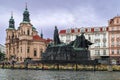 Old Town Square with the Church of St. Nicholas and the monument to Master JÃ¡n Hus in Prague. Royalty Free Stock Photo