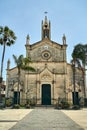 Baroque facade of a historic church with a clock and a bell tower on the island of Sicily Royalty Free Stock Photo