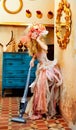 Baroque fashion blonde housewife vacuum cleaner