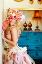 Baroque fashion blonde woman with flowers hat Royalty Free Stock Photo