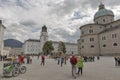 Baroque fountain and Dom Cathedral in the Residenzplatz. Salzburg, Austria.