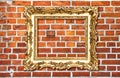 Baroque golden picture frame on red brick wall Royalty Free Stock Photo