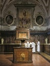 Baroque interior of The Abbey of Monte Oliveto Maggiore is a large Benedictine monastery in the Italian region of Tuscany