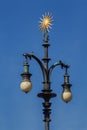 Baroque lamp with ornament of gold-plated sun. Prague.