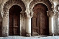 Baroque medieval door made of wood with patterned arches and columns.