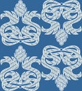 Baroque ornamental motif, white embroidered lace on blue background
