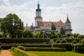 Baroque romantic castle Nove mesto nad Metuji with park, renaissance chateau, round white clock tower, red tile roof, Italian