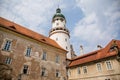 Baroque romantic castle Nove mesto nad Metuji with park, renaissance chateau, round white clock tower, red tile roof, Italian