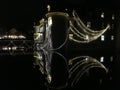 Baroque Schloss Bottmingen near Basel in Switzerland in night, reflection in the calm mirror-like moat water, christmas decoration