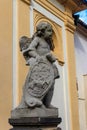 Baroque statue before facade Loreta Monastery in Prague, Czech Republic Royalty Free Stock Photo