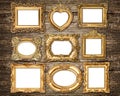 Baroque style golden frames over wooden background. Antique objects Royalty Free Stock Photo