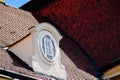 Baroque style roof dormer with oval wooden window