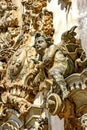 Baroque style sculptures and ornaments on the front facade of a old and historic church Royalty Free Stock Photo