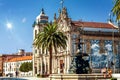 The Baroque twin churches Igreja das Carmeli and Igreja do Carmo with blue azulejo tiles and the Lion Fountain in the foreground