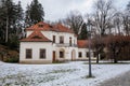 Baroque white benedictine monastery Brevnov with church, Pavilion Vojteska, Garden and park, abbey under snow in winter day, Royalty Free Stock Photo