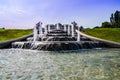 old big ancient fountain made of white marble. Beautiful cascading fountain with antique sculptures in the park