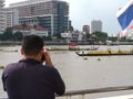 Thai man take a photo to the Royal Baeque Coronation