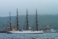 The barque Sedov at anchor in the Amur Bay against the background of the foggy Russian island Royalty Free Stock Photo