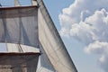 Barquentine yacht sails rigging clouds background Royalty Free Stock Photo