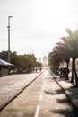 Barra da Tijuca boardwalk on a beatiful afternoon, withbuildings in the background. Rio de Janeiro, orange flare