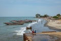 BARRA, THE GAMBIA - NOVEMBER 18, 2019: Pleople workingh at the beach in Barra, Gambia