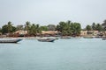 BARRA, THE GAMBIA - NOVEMBER 18, 2019: Pleople workingh at the beach in Barra, Gambia Royalty Free Stock Photo