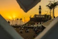 Barra Lighthouse portrait framed by the beach railing in Salvador, Brazil Royalty Free Stock Photo