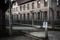 Barrack and barbed wire fence, prison Auschwitz II