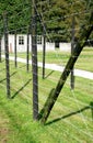 Barrack behind barbed wire in a concentration camp Royalty Free Stock Photo