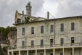 Barracks and lighthouse of the federal prison of Alcatraz Island of the United States of America in the bay of San Francisco Royalty Free Stock Photo