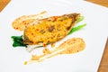 Barramundi steak with spicy sauce Royalty Free Stock Photo