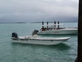 Two speed boats docked at Barraterre, the northwest tip of the Great Exuma in the Bahamas Royalty Free Stock Photo