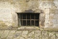 Barred basement window of an old building Royalty Free Stock Photo
