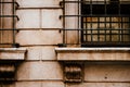 Barred windows and ancient grimy masony in Rome Royalty Free Stock Photo