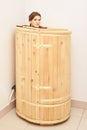 Barrel cedar. Wellness spa sauna. Aromatherapy treatment. Young beauty woman. Girl face