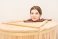 Barrel cedar. Wellness spa sauna. Aromatherapy treatment. Young beauty woman. Girl face