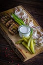 Barrel cucumbers, sliced lard, fried bread and onions on the wooden board on gray background Royalty Free Stock Photo