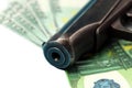 He barrel of a gun lie on banknotes Royalty Free Stock Photo