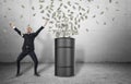 Barrel loads with money bursting out of it and happy businessman in celebrating pose