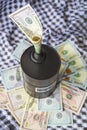 Barrel of oil on a background, american dollars and arabian background. Falling trend of barrel price decrease of earning and Royalty Free Stock Photo