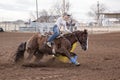 Woman competing in a barrel race in small town in West Texas