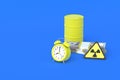 Barrel with toxic substance, money, alarm clock and radiation sign