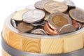 Barrel with various coins Royalty Free Stock Photo