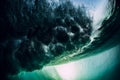Barrel wave underwater with air bubbles and sun light. Ocean in underwater Royalty Free Stock Photo