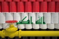 Barrels with flag of Iraq and gas transportation pipe. 3d rendering