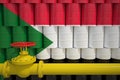 Barrels with flag of Sudan and gas transportation pipe. 3d rendering