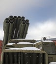 Barrels of modern multiple launch rocket system in the parking lot front view