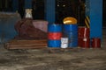 Barrels of oil and fuel, lubricating materials in a dark warehouse at the industrial refinery chemical petrochemical