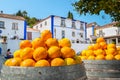 Barrels with oranges. Obidos, Portugal