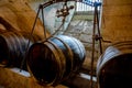 Barrels in a rustic wine cellar